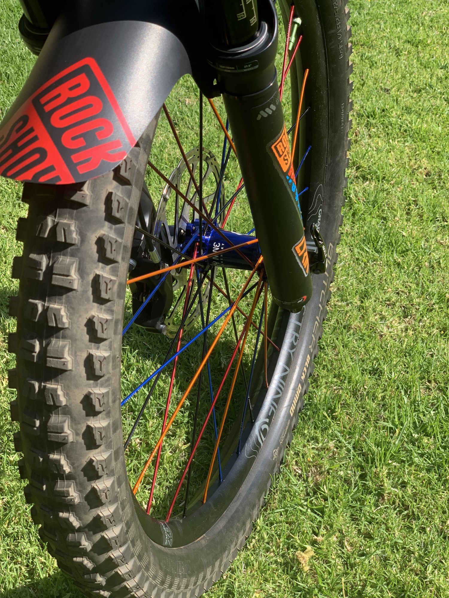 Front i9 wheel build with blue hub on Grade 300 DH rim.